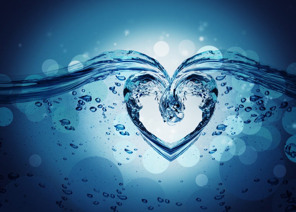 Heart from water splash with bubbles